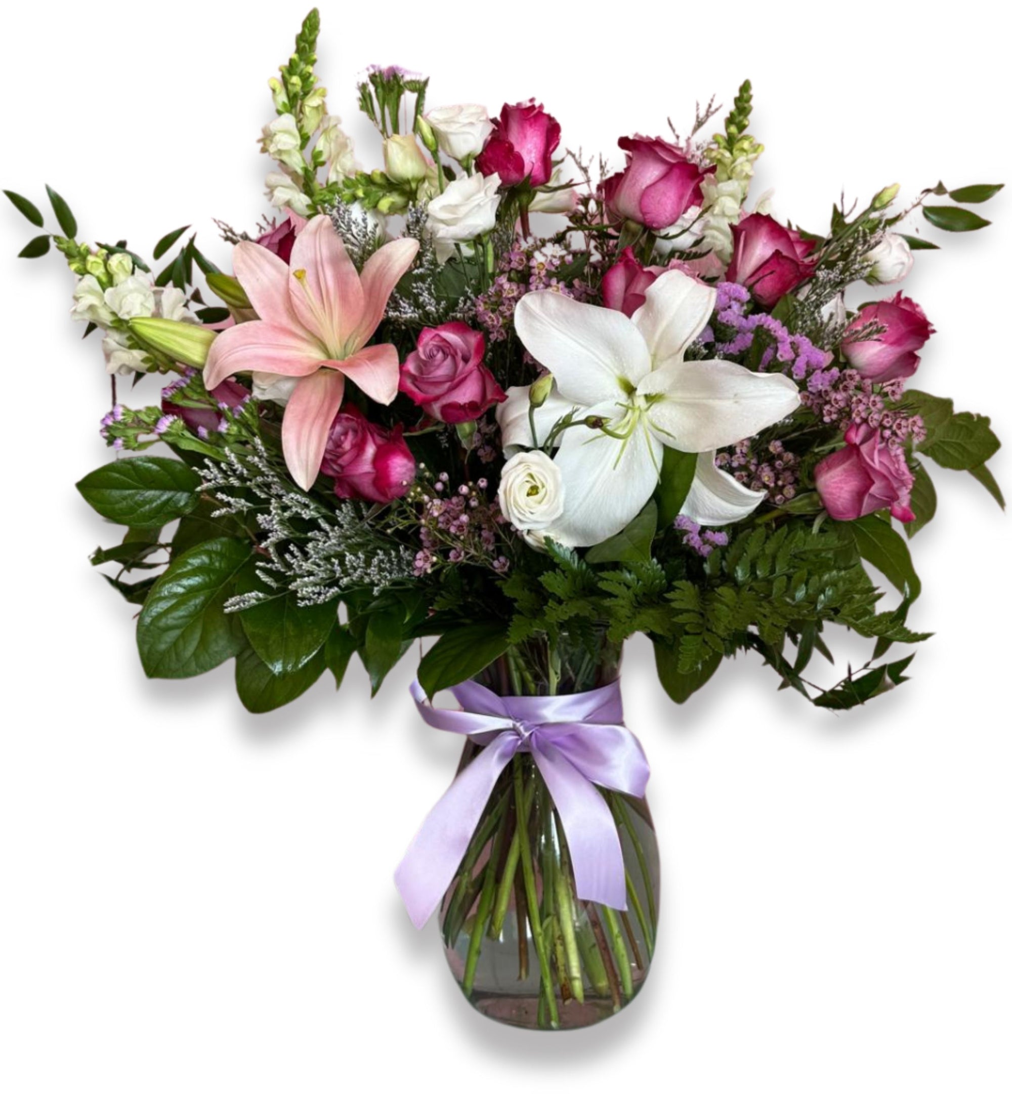 Whispers of Love Bouquet – romantic flower arrangement with pink roses, white lilies, and fresh greenery in a clear glass vase with lavender ribbon, perfect for Richmond Hill same-day flower delivery.